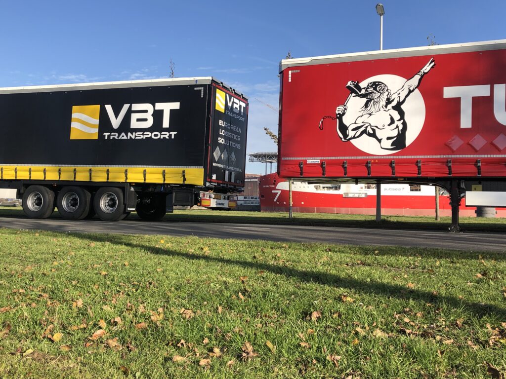 VBT Transport trailer next to a red Tunderman Trailer